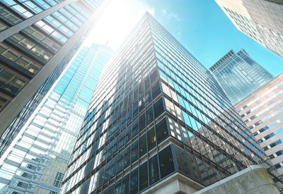 Sun reflecting on glass buildings